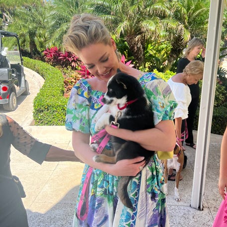 Actress Katherine Heigl holds a rescued dog at Big Dog Ranch Rescue's fundraiser at Mar-a-Lago in Palm Beach on Sunday, March 8, 2026.