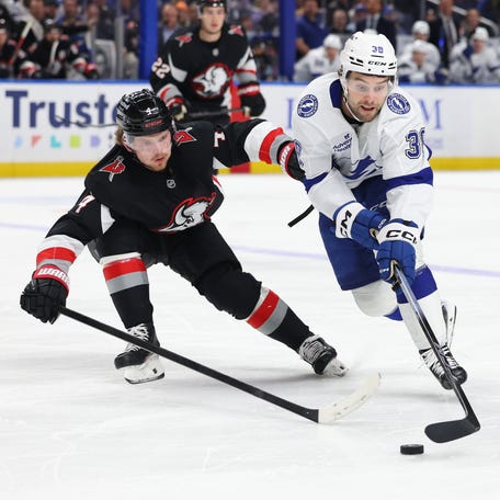 Tampa Bay Lightning left wing Brandon Hagel (38) controls the puck as Buffalo Sabres defenseman Bowen Byram (4) defends during the third period of their game in Buffalo on March 8, 2026.
