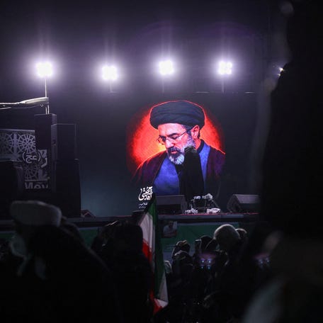 A picture of Iran's new supreme leader, Mojtaba Khamenei, is displayed on a screen in Tehran on March 9, 2026.