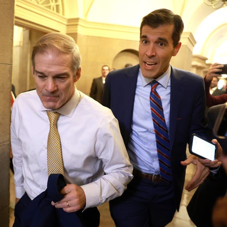 Scott MacFarlane questions U.S. Rep. Jim Jordan (R-OH) as he walks to a meeting with House Republicans at the U.S. Capitol Building on Oct. 17, 2023, in Washington, DC.