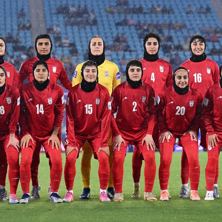 Iran players pose for a team group photo before their Asian Cup match with the Phillipines on March 8, 2026, on Australia's Gold Coast. Five members of the team have accepted asylum in Australia.