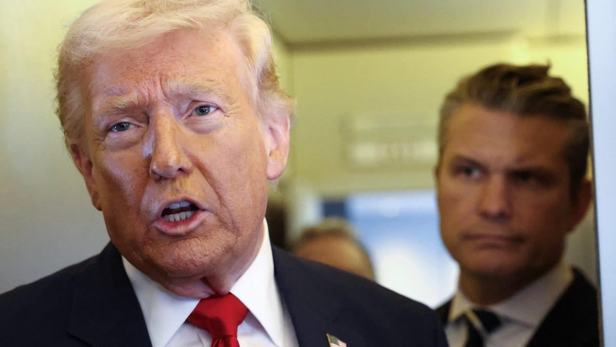 President Donald Trump, with Defense Secretary Pete Hegseth, speaks to reporters aboard Air Force One on a flight from Dover, Delaware, to Miami, Florida, on March 7, 2026.