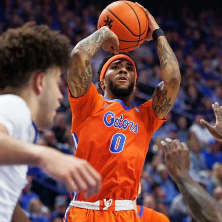 Florida center Rueben Chinyelu (9) shoots the ball during the first half against Kentucky at Rupp Arena at Central Bank Center.