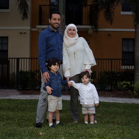 Temporary Protected Status (TPS) holders Mohammad Alala his wife Dania both from Syria and their two U.S. born children Taim and Amr pose for a picture near their home in Miramar, Florida, U.S., January 24, 2018.