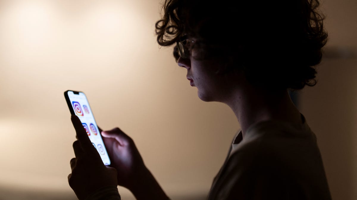 Teenager Bruno scrolls through social media on his phone in Madrid on Feb. 4, 2026.
