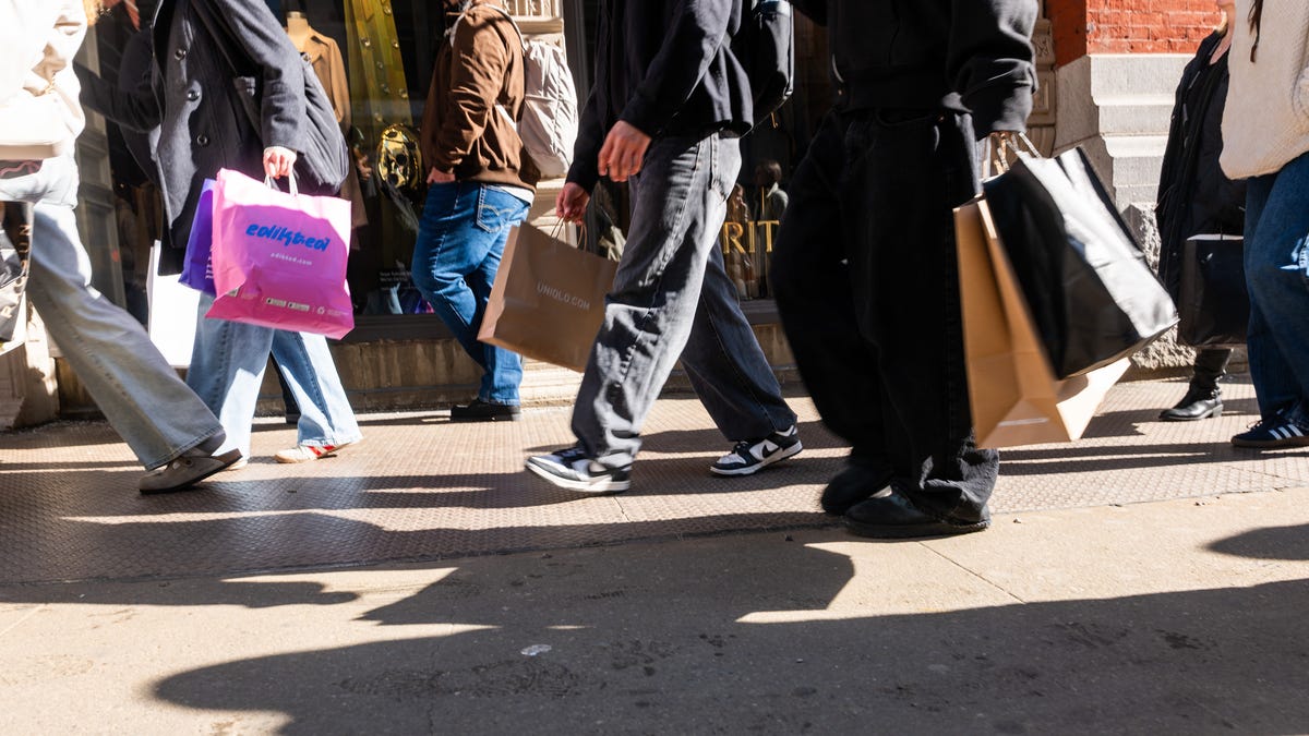 NEW YORK, NEW YORK - FEBRUARY 27: People walk along Broadway with shopping bags in Manhattan on February 27, 2026 in New York City. (Photo by Spencer Platt/Getty Images)