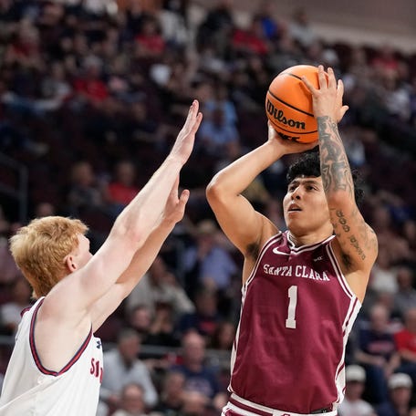 Santa Clara Broncos guard Christian Hammond (1) shoots the basketball against Saint Mary's Gaels guard Joshua Dent (7) during the first half at Orleans Arena.