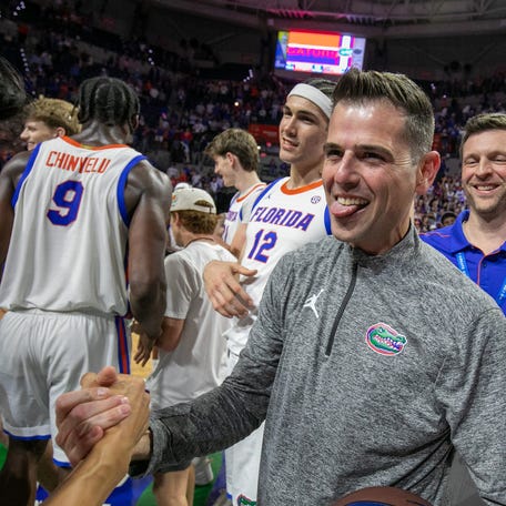 Florida head coach Todd Golden celebrates his 100th win and beating Mississippi State 108-77 an NCAA mens basketball game at Steven C. O'Connell Center Exactek arena in Gainesville, FL on Tuesday, March 3, 2026. [Alan Youngblood/Gainesville Sun]