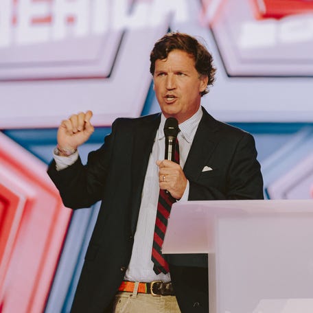 Conservative political commentator and podcast host Tucker Carlson speaks at the annual conference of Turning Point USA in Phoenix on Dec. 18, 2025.