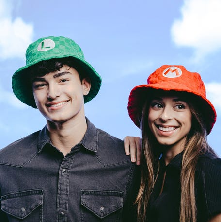 EMBARGOED UNTIL WEDNESDAY, MARCH 11 AT 2 P.M. ET - New Mario-related merch include these retro-styled bucket hats.