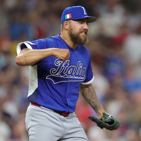 Team Italy relief pitcher Greg Weissert celebrates closing out his team's 8-6 victory against Team USA.