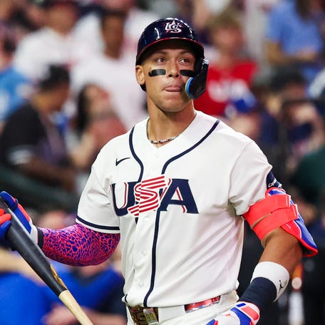 Aaron Judge walks off the field after striking out to end the game against Italy.