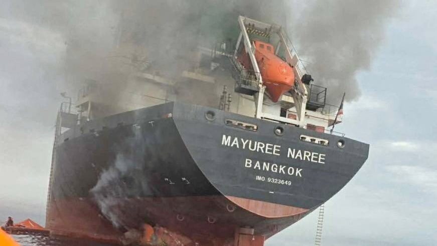 The Thailand-flagged cargo ship Mayuree Naree engulfed in black smoke in the Strait of Hormuz, March 11, 2026.