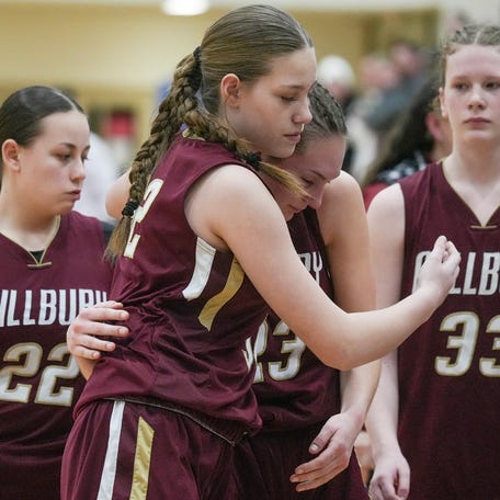 Millbury’s Natalie Small and Mila Nikiforow console one another after their loss to Frontier in the state semifinal game March 11 at West Springfield High School.