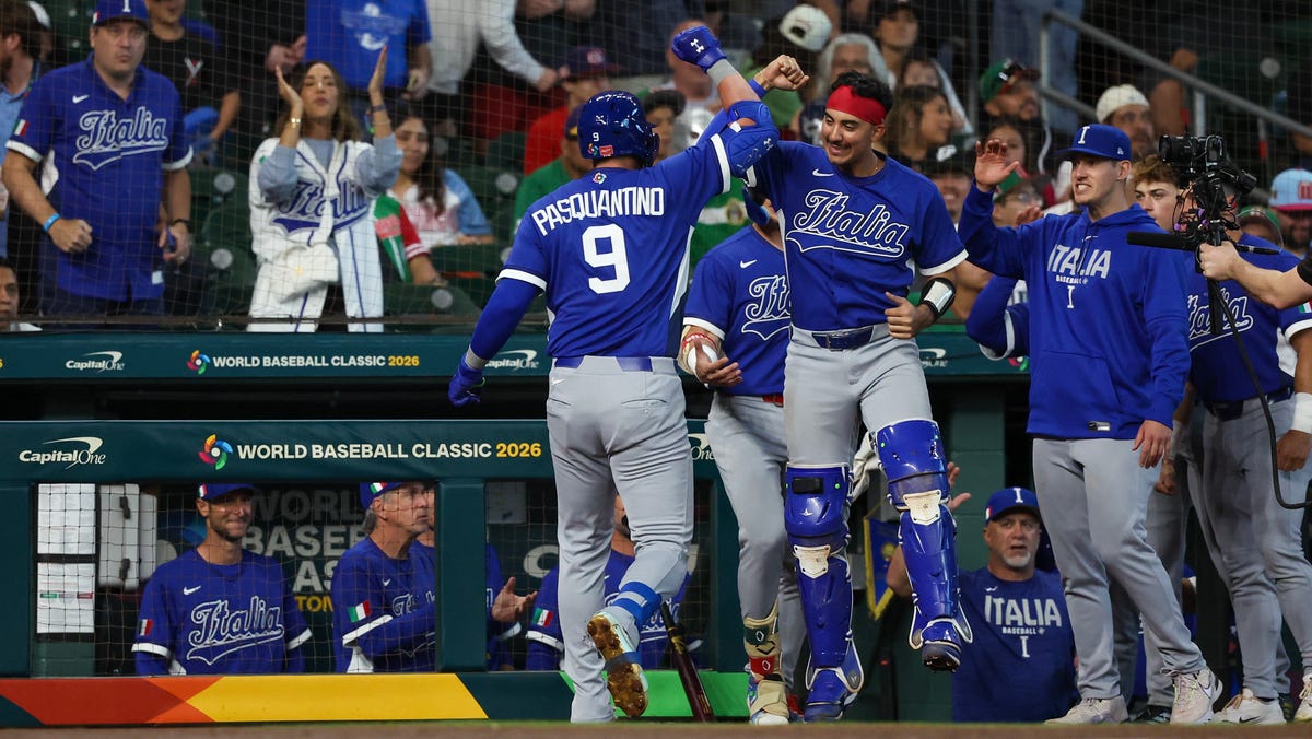 Italy catcher J.J. D'orazio (28) celebrates first baseman Vinnie Pasquantino's (9) home run against Mexico in the second inning at Daikin Park.