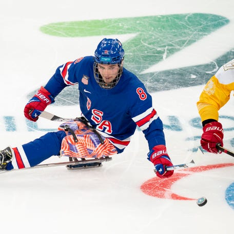 Team USA's Jack Wallace (#8) passes the puck during the game against Team China during the Milano-Cortina 2026 Paralympic Winter Games at Milano Santagiulia Ice Hockey Arena on Mar. 10, 2026. Drew Garrison-USA TODAY