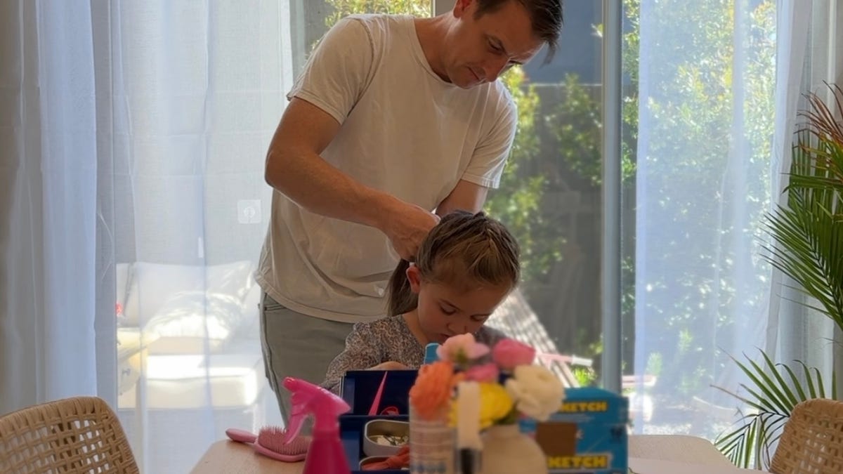 Beers and braids? Dads are stepping up to do their daughters' hair.