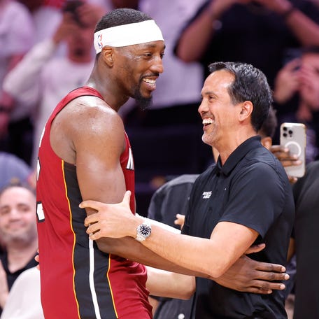 Heat center Bam Adebayo (13) celebrates with head coach Erik Spoelstra after becoming the NBA's second-highest scorer with 83 points against the Wizards.