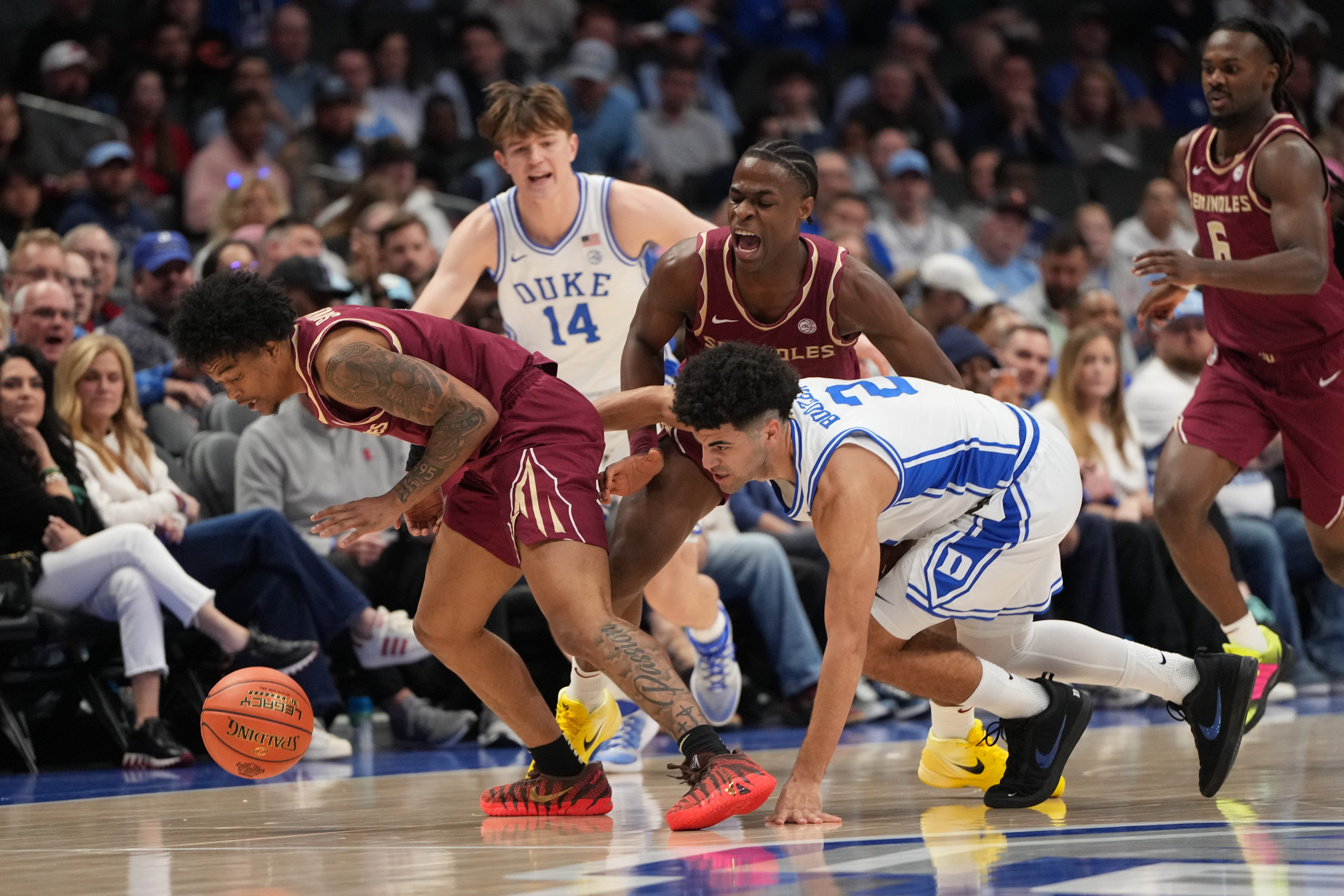 A Duke basketball player driving to the hoop