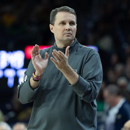 Feb 28, 2026; South Bend, Indiana, USA; NC State Wolfpack head coach Will Wade claps against the Notre Dame Fighting Irish during the first half at Purcell Pavilion at the Joyce Center. Mandatory Credit: Michael Caterina-Imagn Images