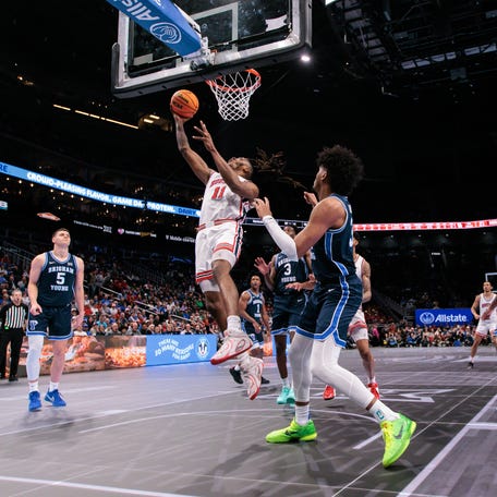 Houston Cougars forward Joseph Tugler (11) shoots the ball during the second half against the BYU Cougars at T-Mobile Center.