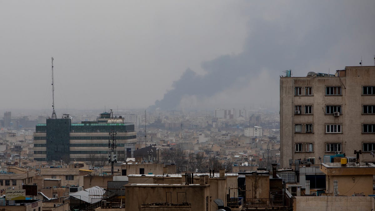 Smoke rises in the distance following an airstrike at the same time a Quds Day demonstration takes place on March 13, 2026, in Tehran, Iran. International Quds Day (which takes its name from the Arabic name for Jerusalem) is an annual pro-Palestinian event created in Iran in 1979 and held on the last Friday of Ramadan. The demonstration comes amid the continuing war between Iran and the United States and Israel.