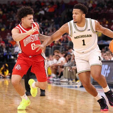 CHICAGO, ILLINOIS - MARCH 13: Trey McKenney #1 of the Michigan Wolverines drives to the basket against John Mobley Jr. #0 of the Ohio State Buckeyes during the first half in the quarterfinals of the 2026 Big Ten Men's Basketball Tournament at the United Center on March 13, 2026 in Chicago, Illinois. (Photo by Michael Reaves/Getty Images)
