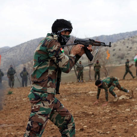 A fighter from the Iranian Kurdistan Freedom Party (PAK) takes part in a training exercise at a base near Erbil, Iraq February 12, 2026.