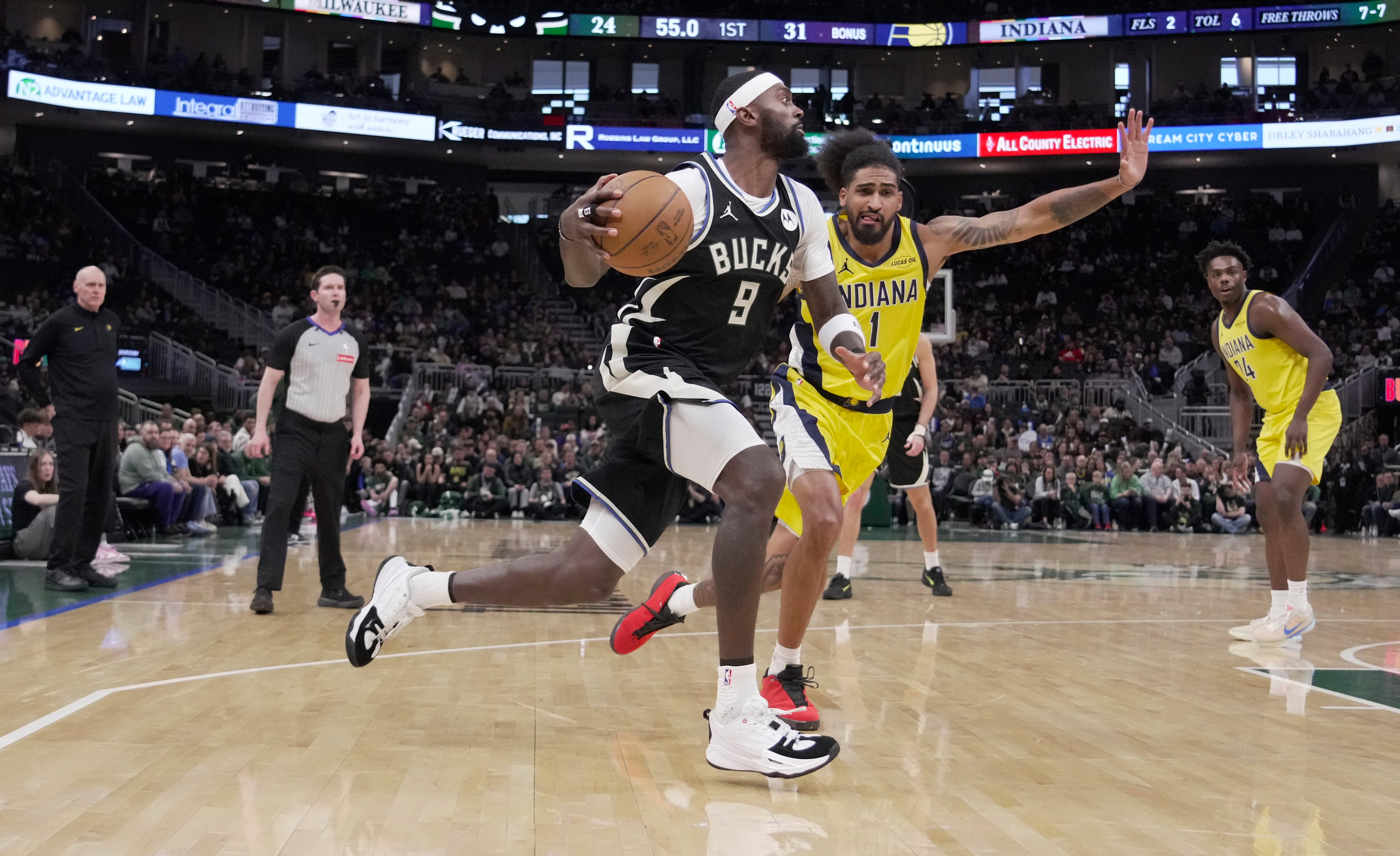 Giannis Antetokounmpo driving to the basket against the Pacers