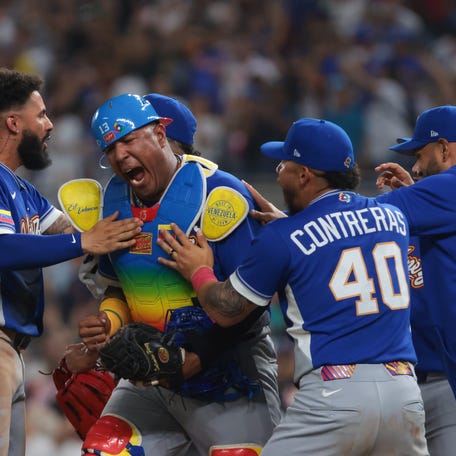 Venezuela players celebrate after beating Japan.