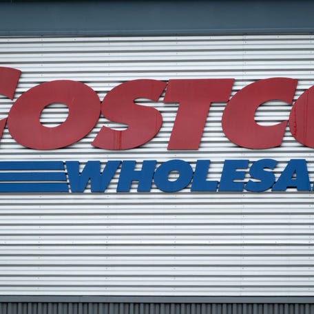 A "Costco Wholesale" sign hangs in front of a Chicago, Illinois on Dec. 2, 2025.