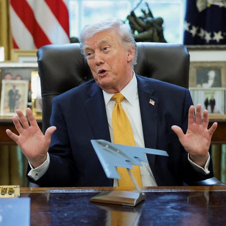 President Donald Trump uses a model of a B‑2 bomber in the Oval Office at the White House on March 16, 2026, to commemorate Operation Midnight Hammer, which attacked Iran's three nuclear facilities in June.