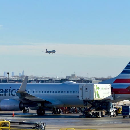 An American Airlines sits at a gate of Chicago O'Hare International Airport in the northwest side of Chicago, Illinois on January 15, 2026. (Photo by Daniel SLIM / AFP via Getty Images)