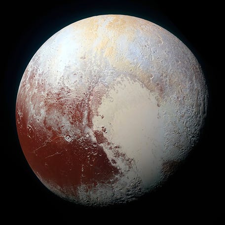 A heart shaped region named Sputnik Planum is seen in enhanced view of the dwarf planet Pluto in an undated image from NASA's New Horizons spacecraft.