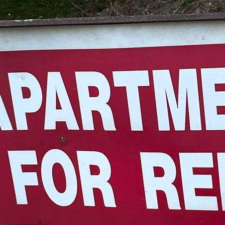 Apartment for Rent sign.