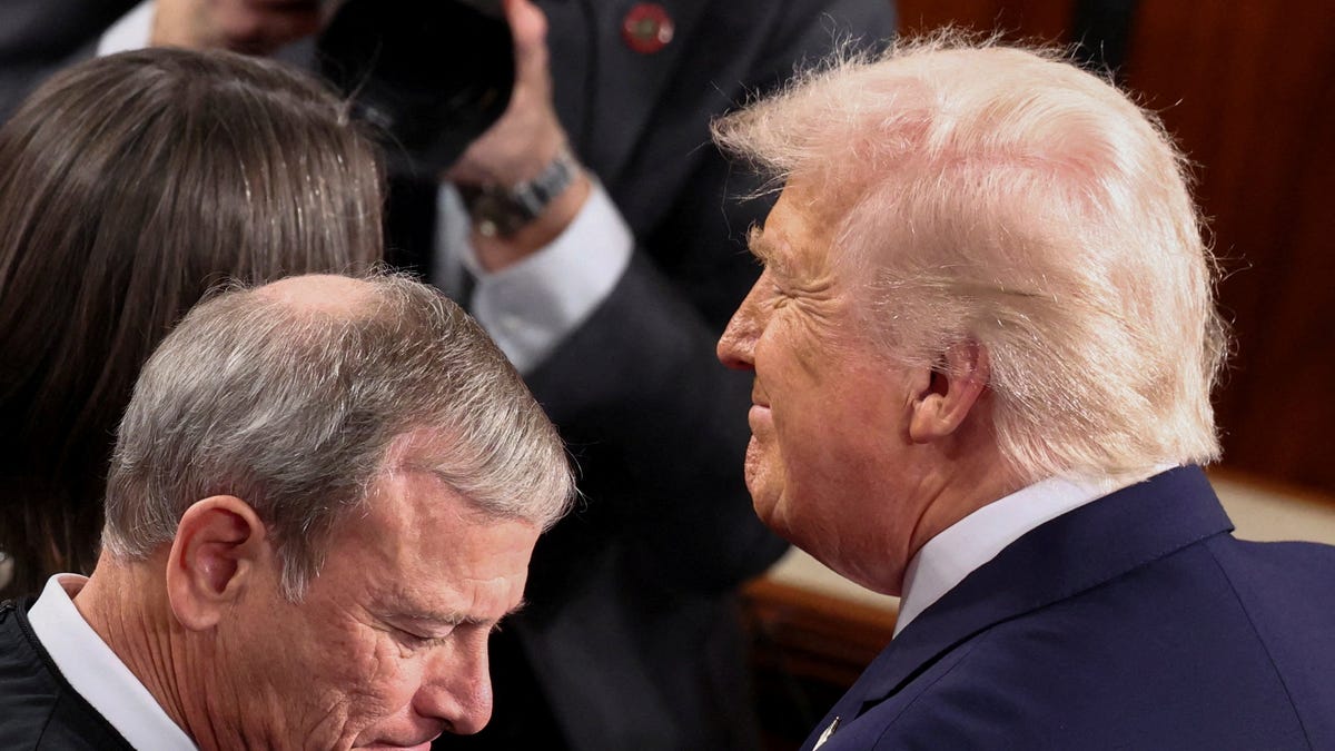 President Donald Trump, next to Supreme Court Chief Justice John Roberts, arrives to deliver the State of the Union address to a joint session of Congress in the U.S. Capitol on Feb. 24, 2026.