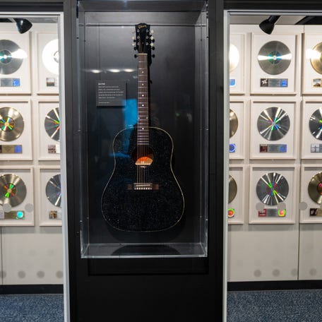 Taylor Swift's "All Too Well" guitar of black crystals hangs at the Country Music Hall of Fame and Museum in Nashville. March 18, 2026.