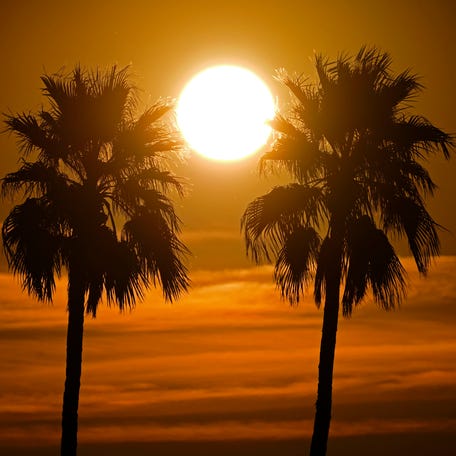 The sun rises on March 18, 2026, on what was the earliest 100-degree day in Phoenix weather history.