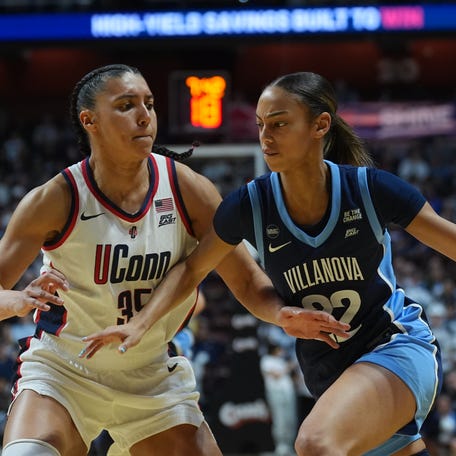 UConn guard Azzi Fudd (35) defends against Villanova guard Kennedy Henry (22).
