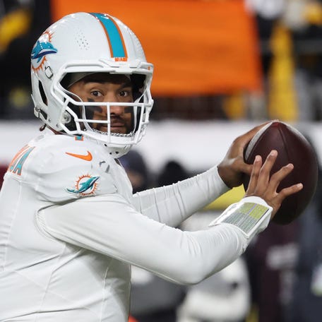 Dec 15, 2025; Pittsburgh, Pennsylvania, USA; Miami Dolphins quarterback Tua Tagovailoa (1) looks to throw in the second quarter against the Pittsburgh Steelers at Acrisure Stadium. Mandatory Credit: Charles LeClaire-Imagn Images