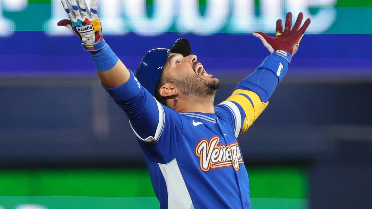 Mar 17, 2026; Miami, FL, United States; Venezuela third baseman Eugenio Suarez (7) reacts after hitting a RBI double against the United States in the ninth inning during the 2026 World Baseball Classic Championship game at loanDepot Park. Mandatory Credit: Sam Navarro-Imagn Images