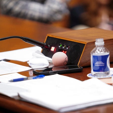 Documents and a rubber ball sitting in front of Sen. Markwayne Mullin, President Donald Trump's nominee to be Homeland Security secretary, as he testifies before a Senate Homeland Security Committee hearing on March 18, 2026.