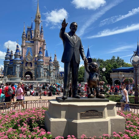 People gather at the Magic Kingdom theme park before the "Festival of Fantasy" parade at Walt Disney World in Orlando, Florida, U.S. July 30, 2022.