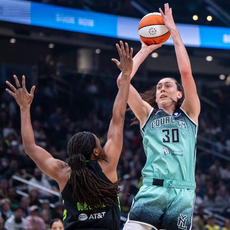 Sep 5, 2025; Seattle, Washington, USA; New York Liberty forward Breanna Stewart (30) shoots the ball against Seattle Storm forward Nneka Ogwumike (3) during the first half at Climate Pledge Arena. Mandatory Credit: Stephen Brashear-Imagn Images