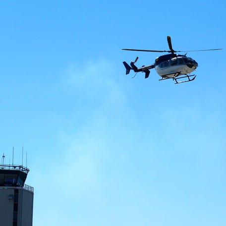 A helicopter flies overhead during the sixth annual Meet a Machine at the Augusta Regional Airport in Augusta, Georgia on Sept. 13, 2025.