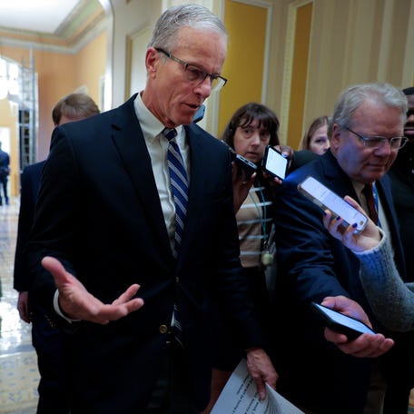 WASHINGTON, DC - MARCH 12: Senate Majority Leader John Thune (R-SD) (C) talks with reporters as he heads for the Senate Chamber at the U.S. Capitol on March 12, 2026 in Washington, DC. Thune is being pressured by conservatives to do away with the 60-vote cloture threshold and move the SAVE America Act forward, a priority for President Donald Trump going into the midterm elections. (Photo by Chip Somodevilla/Getty Images)
