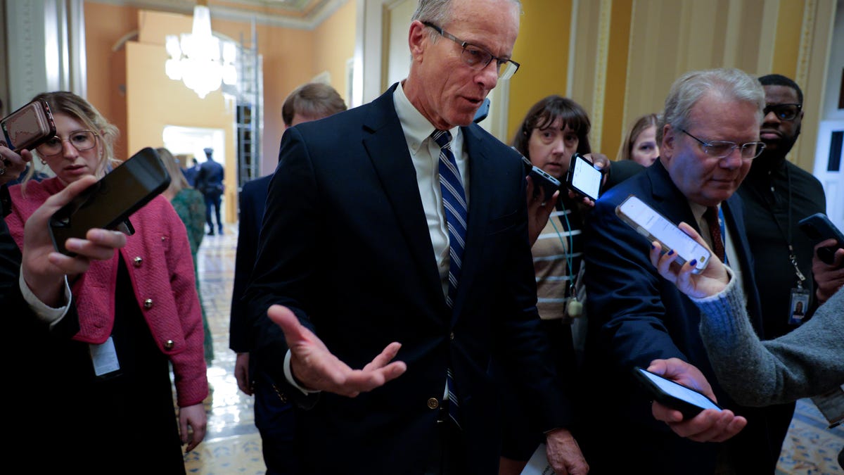 WASHINGTON, DC - MARCH 12: Senate Majority Leader John Thune (R-SD) (C) talks with reporters as he heads for the Senate Chamber at the U.S. Capitol on March 12, 2026 in Washington, DC. Thune is being pressured by conservatives to do away with the 60-vote cloture threshold and move the SAVE America Act forward, a priority for President Donald Trump going into the midterm elections. (Photo by Chip Somodevilla/Getty Images)