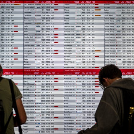 A flight board is seen as many flights are cancelled due to an Air Canada flight attendants' general strike at Montréal-Pierre Elliott Trudeau International Airport on August 16, 2025, in Montreal, Canada.