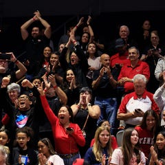 Bishop Kenny Crusaders fans cheer after the game of the FHSAA Class 4A girls basketball final at UNF Arena, Thursday, March 12, 2026 in Jacksonville, Fla. The Bishop Kenny Crusaders defeated the Bishop Moore Hornets 58-48, capturing the state title.