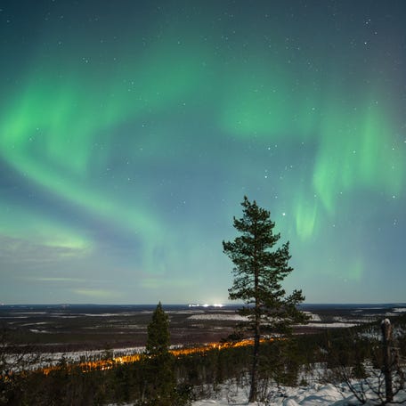 Northern lights illuminate the night sky over the Levi region in Lapland Finland, in December 2025.